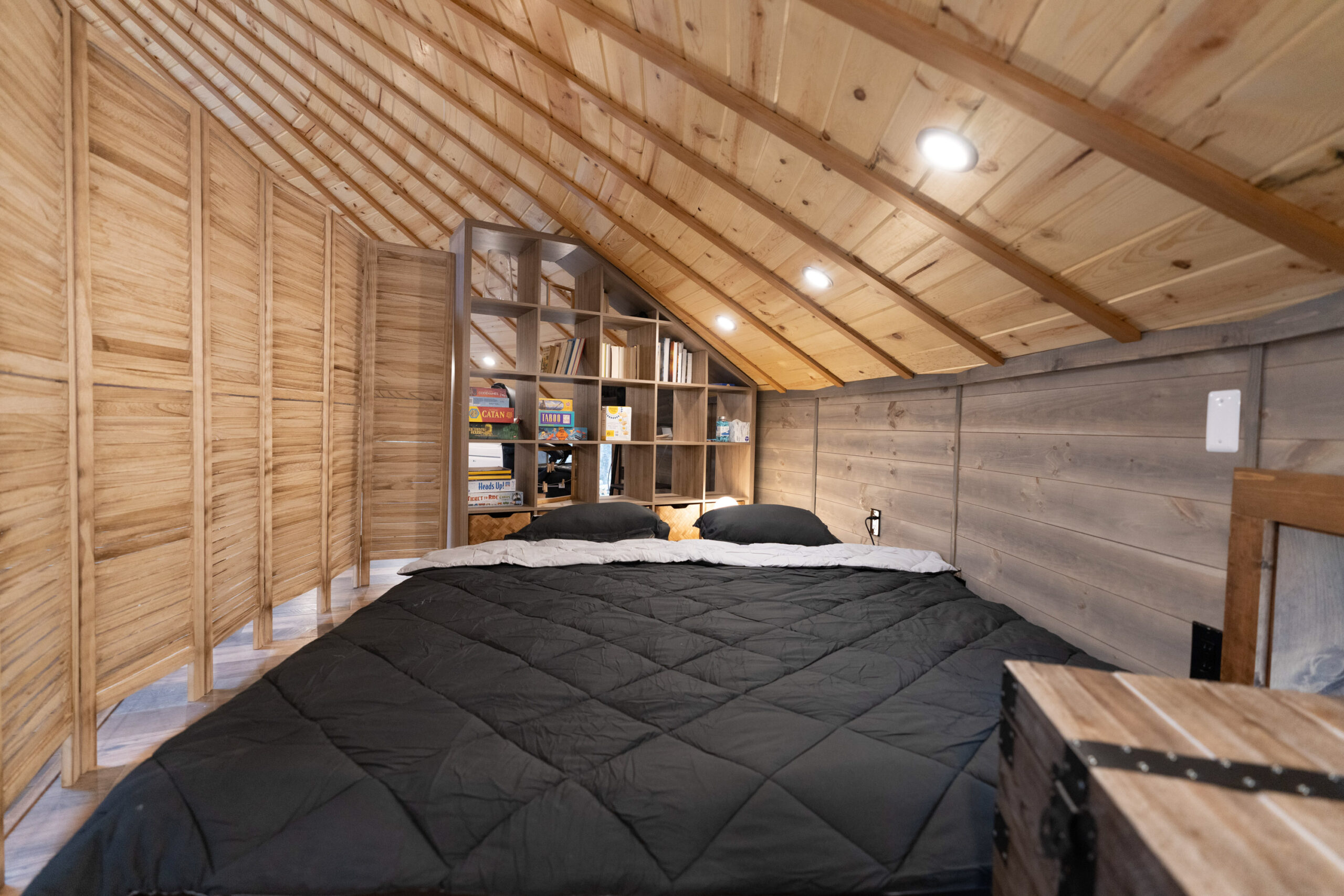 Floor sofa transformed into KING size bed with a privacy screen -- Shenandoah Yurt, Shenandoah Cabin