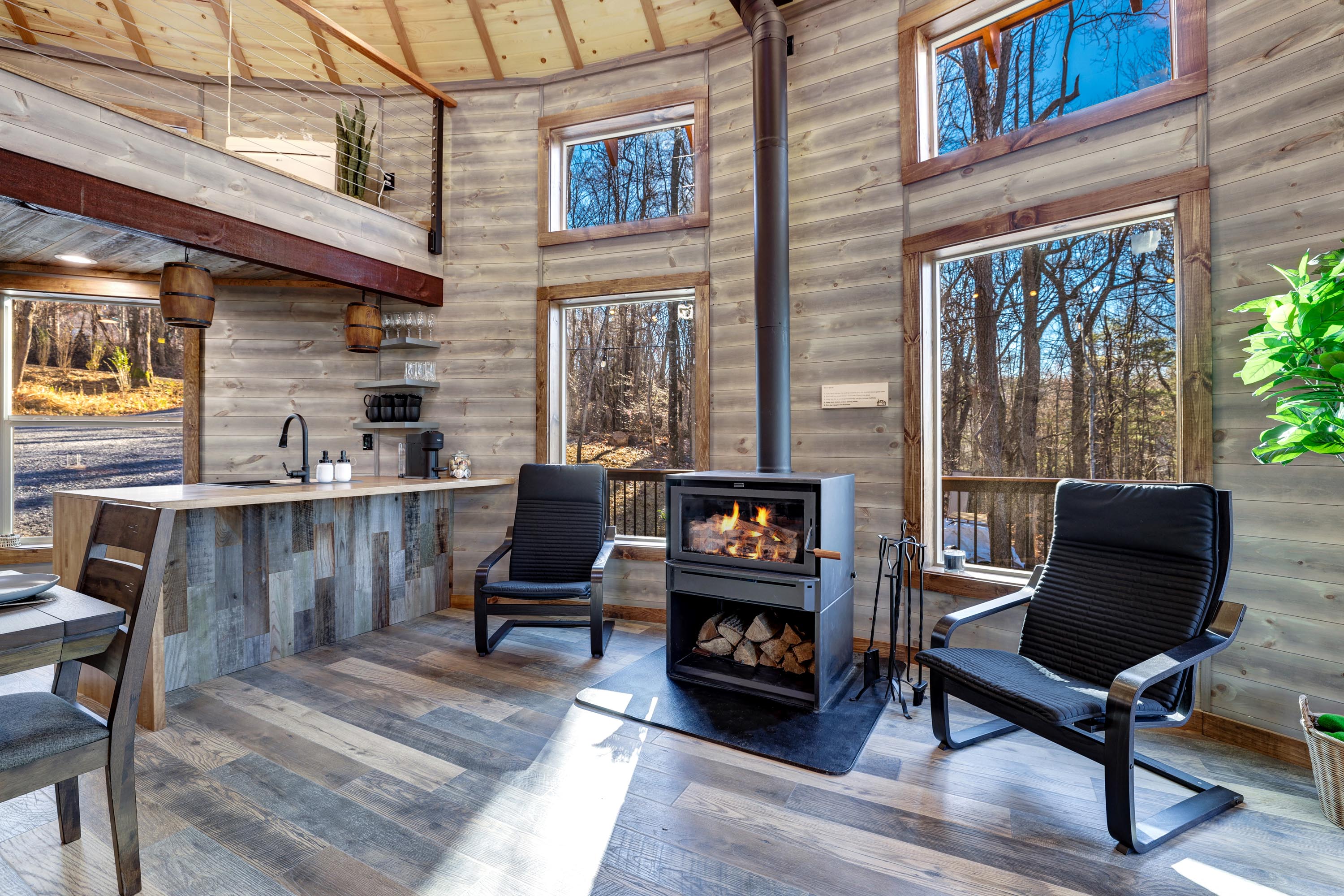 <span  class="uc_style_uc_tiles_grid_image_elementor_uc_items_attribute_title" style="color:#ffffff;">Two rocking chairs and a wood stove</span>