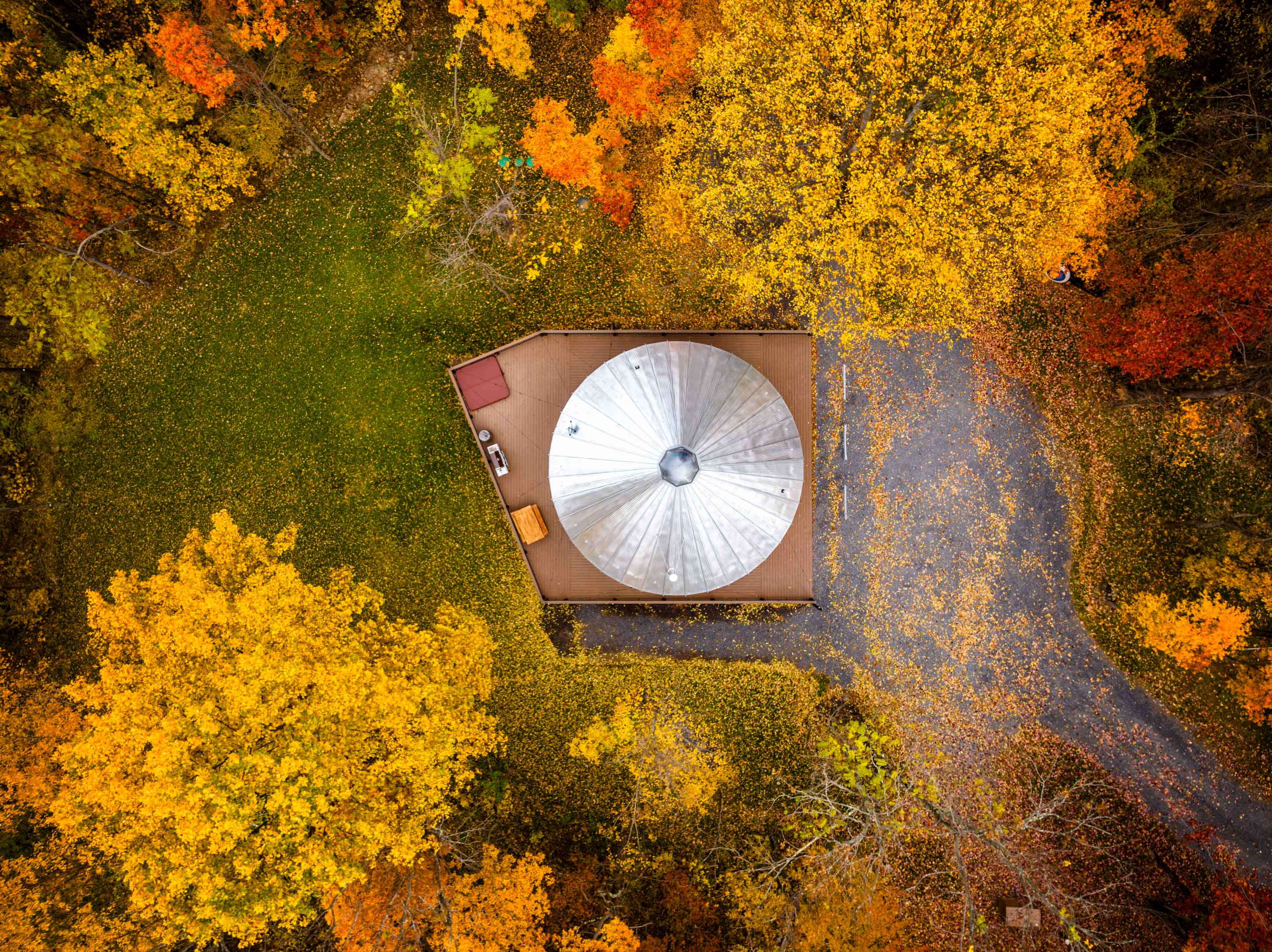 <span  class="uc_style_uc_tiles_grid_image_elementor_uc_items_attribute_title" style="color:#ffffff;">Golden sunset hues casting a warm, serene glow over the Shenandoah Yurt amid the peaceful fall season</span>